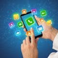 Hand using phone with shiny application icons